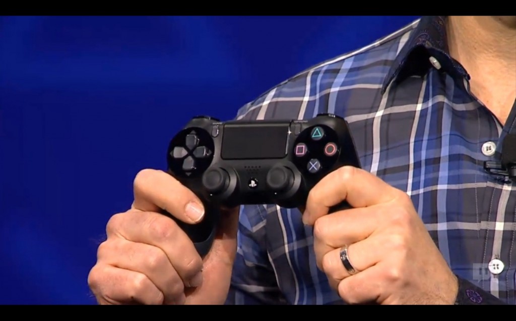 Introducing the new PS4 controller.  Similar, yet different.  Touch pad, convex joysticks, modified d-pad and trigger buttons, all made to be a little nicer to your hands.  It doesn't look bigger though and I thought they were going to make it a little bigger.